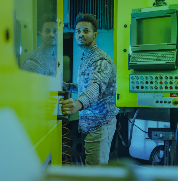 Man in room with mechanical equipment